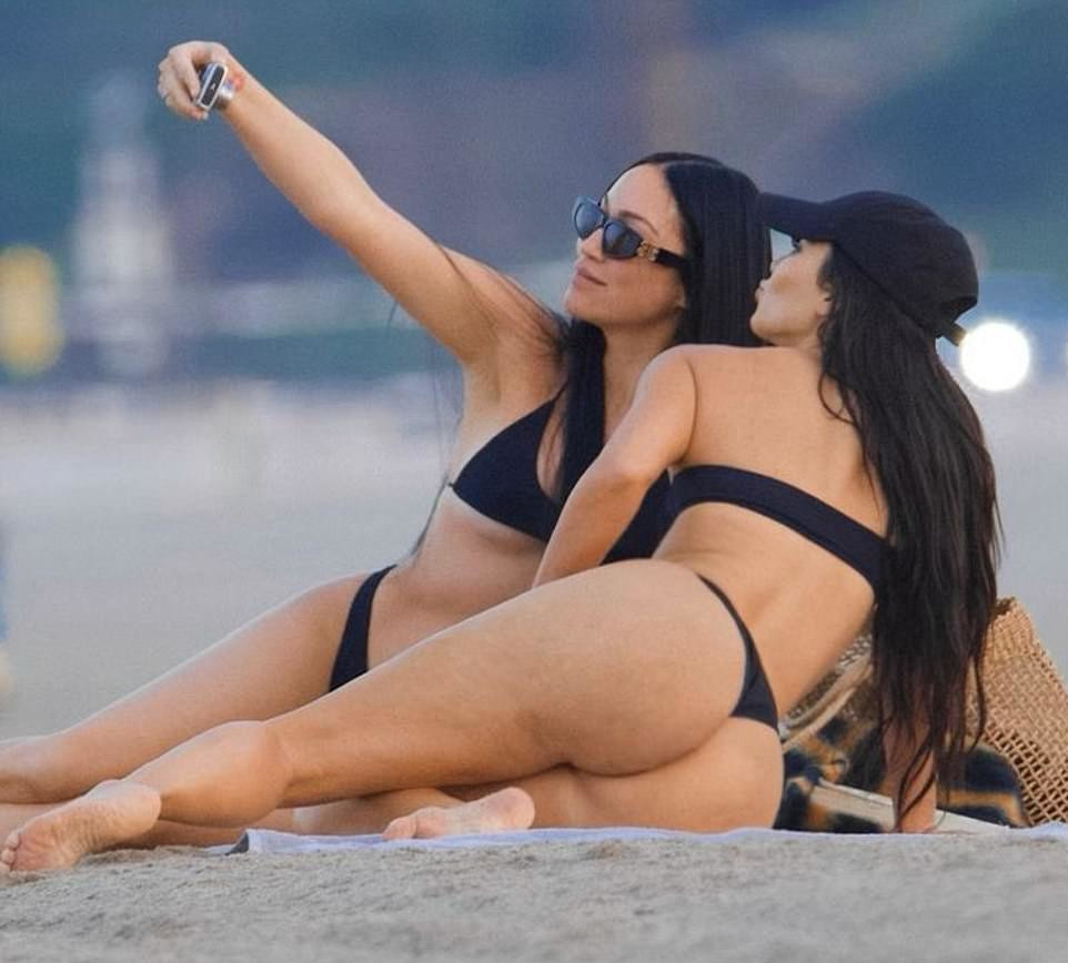 Mega-Slutty Kim Kardashian Snapping Selfies and Having Fun in a Bikini
