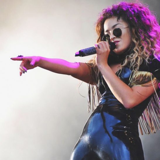 Ella Eyre singing on the stage