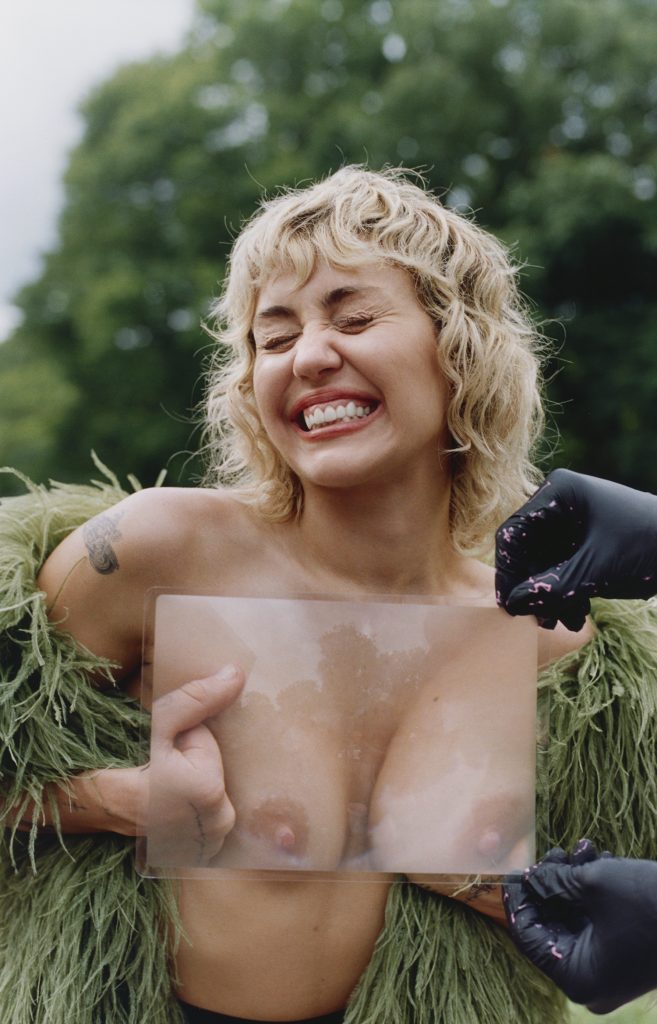 Topless Miley Cyrus Displaying Amazing Flexibility While Posing in the Woods