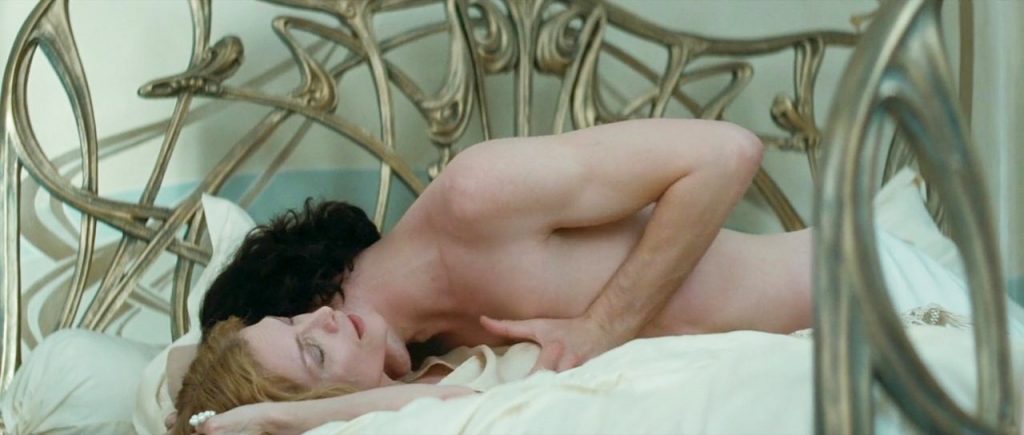 Michelle Pfeiffer with a guy in bed