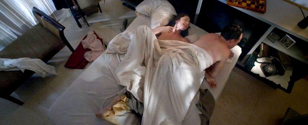 Minka Kelly naked in bed