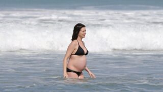 Heavily Pregnant Anne Hathaway Walking Around in a Revealing Black Swimsuit