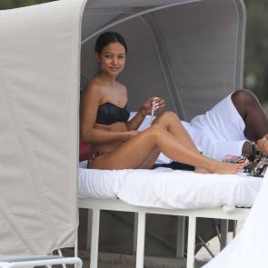 Karrueche Tran lying on bed at the beach